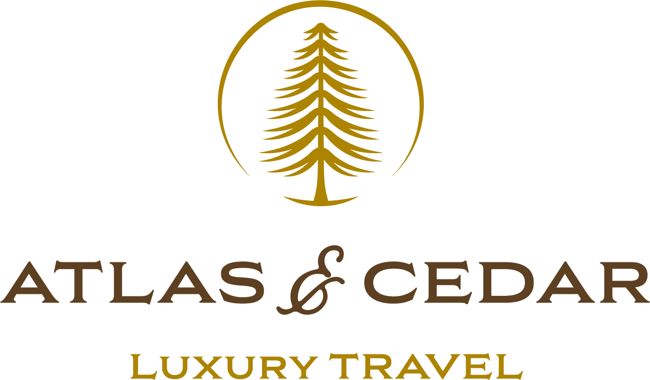 Atlas & Cedar Luxury Travel logo featuring a stylized cedar tree inside a gold circle above the company name in brown text, with "Luxury Travel" in gold text below.
